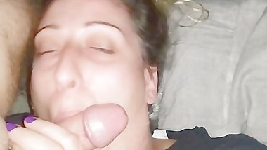 Sucking the balls and swallow with a smile