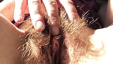 Sexy mature redhead Rachel Wriggler plays with her super bushy pussy and fingers her clit before having a bath