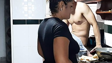 My stepmom gives me a delicious blowjob in the kitchen