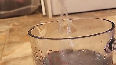 Pissing into a jug.